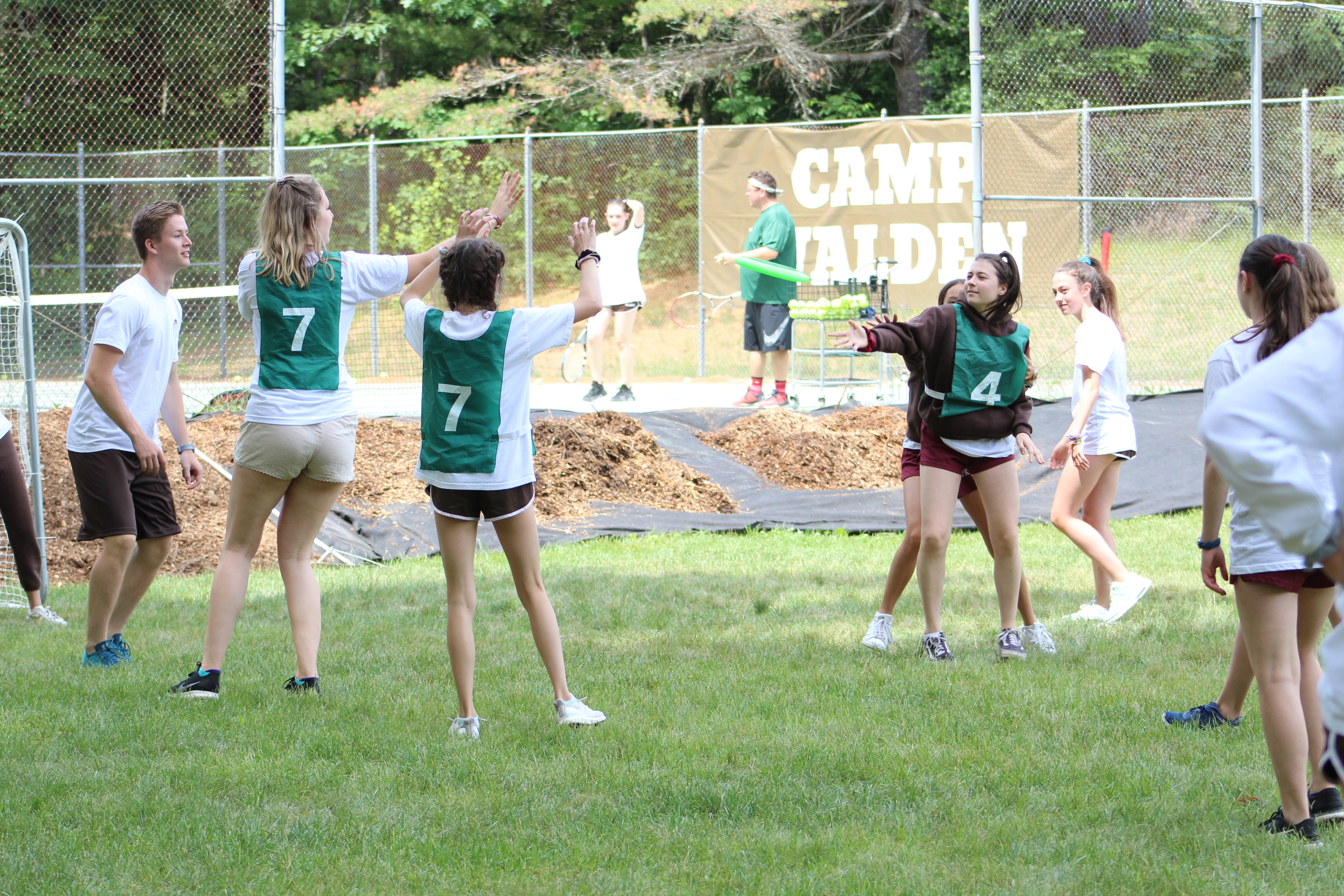 Group of campers playing Ultimate Frisbee at Camp.