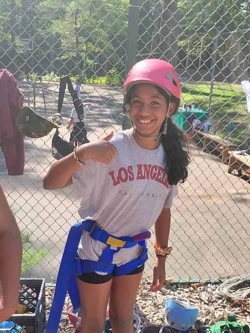 Camper prepares for the rock wall