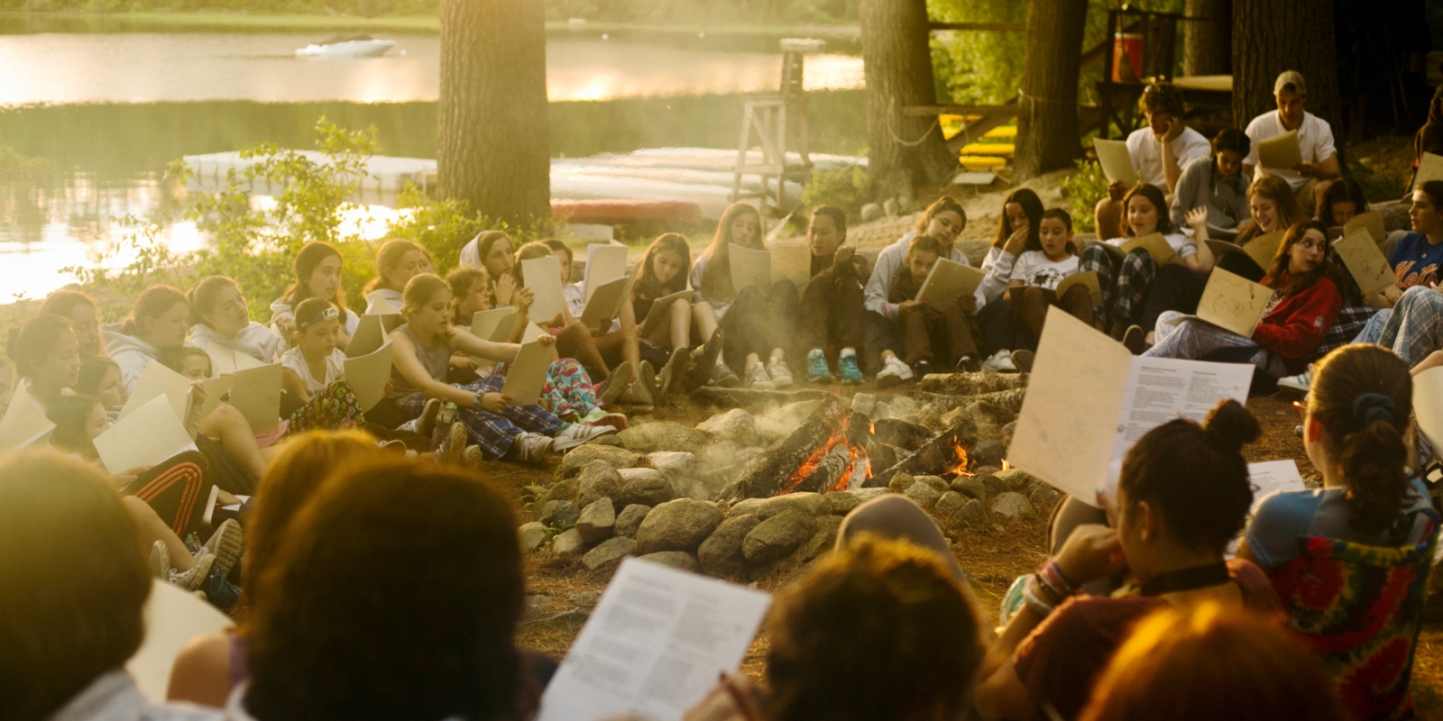 Campers gather around a campfire